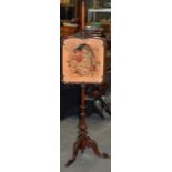 A VICTORIAN CARVED MAHOGANY POLESCREEN, with embroidered panel depicting a parrot. 147 cm.