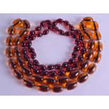 TWO AMBER TYPE NECKLACE. 200 grams & 85 grams. 90 cm & 80 cm long. (2)