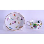19th c. Meissen miniature floral encrusted teacup and saucer painted with flowers.