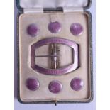 A LOVELY ART DECO SILVER AND ENAMEL CASED BELT BUCKLE with six matching silver and enamel buttons.