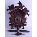 AN EARLY 20TH CENTURY BAVARIAN BLACK FOREST CUCKOO CLOCK of naturalistic form. 30 cm x 36 cm.