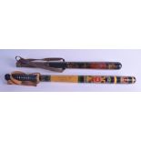 TWO DECORATIVE LACQUERED AND PAINTED POLICEMANS TRUNCHEONS. 45 cm & 52 cm long. (2)