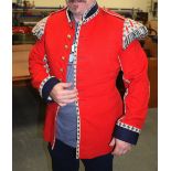 A VINTAGE GUARDSMAN RED JACKET, possibly military band member.