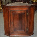 A OAK CORNER CUPBOARD. 83 cm x 82 cm.