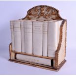 A RARE ASPREYS OF LONDON LIBRARY VELLUM BOOK RACK contained within a painted gilt frame, decorated