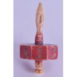 AN UNUSUAL GEORGE III CARVED BONE SPINNING DICE with painted central banding. 6.5 cm long.