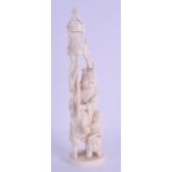 A LATE 19TH CENTURY JAPANESE MEIJI PERIOD CARVED IVORY OKIMONO modelled holding aloft a festival