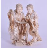 A FINE 19TH CENTURY JAPANESE MEIJI PERIOD CARVED IVORY OKIMONO modelled as two scholars holding an