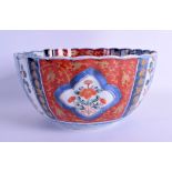 AN EARLY 19TH CENTURY JAPANESE EDO PERIOD IMARI RIBBED BOWL painted with panels of foliage and