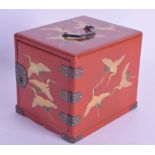 AN EARLY 20TH CENTURY JAPANESE MEIJI PERIOD RED LACQUER MINIATURE CABINET painted with gilt cranes
