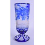 A 19TH CENTURY BOHEMIAN BLUE GLASS GOBLET finely decorated with stags roaming within landscapes.