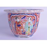 A 19TH CENTURY JAPANESE MEIJI PERIOD IMARI JARDINIERE painted in relief with figures in various