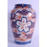 A 19TH CENTURY JAPANESE MEIJI PERIOD BALUSTER VASE painted with floral sprays within blue floral