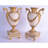 A FINE PAIR OF LATE 18TH CENTURY FRENCH ORMOLU AND MARBLE URNS of beautiful quality, the handles