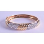 A GOOD 14CT YELLOW GOLD AND DIAMOND HINGED BANGLE. 38.9 grams. 6.5 cm wide.