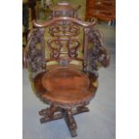 A RARE 19TH CENTURY CHINESE CARVED HARDWOOD SWIVEL CHAIR, finely carved with bats, mythical beasts &