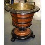 AN ANTIQUE WOODEN BUCKET, with ribbed body on ball feet. 39 cm high.