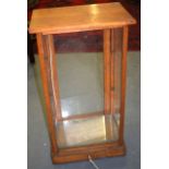 AN EARLY 20TH CENTURY WOODEN GLASS FRONTED DISPLAY CABINET. 78 cm x 43cm.