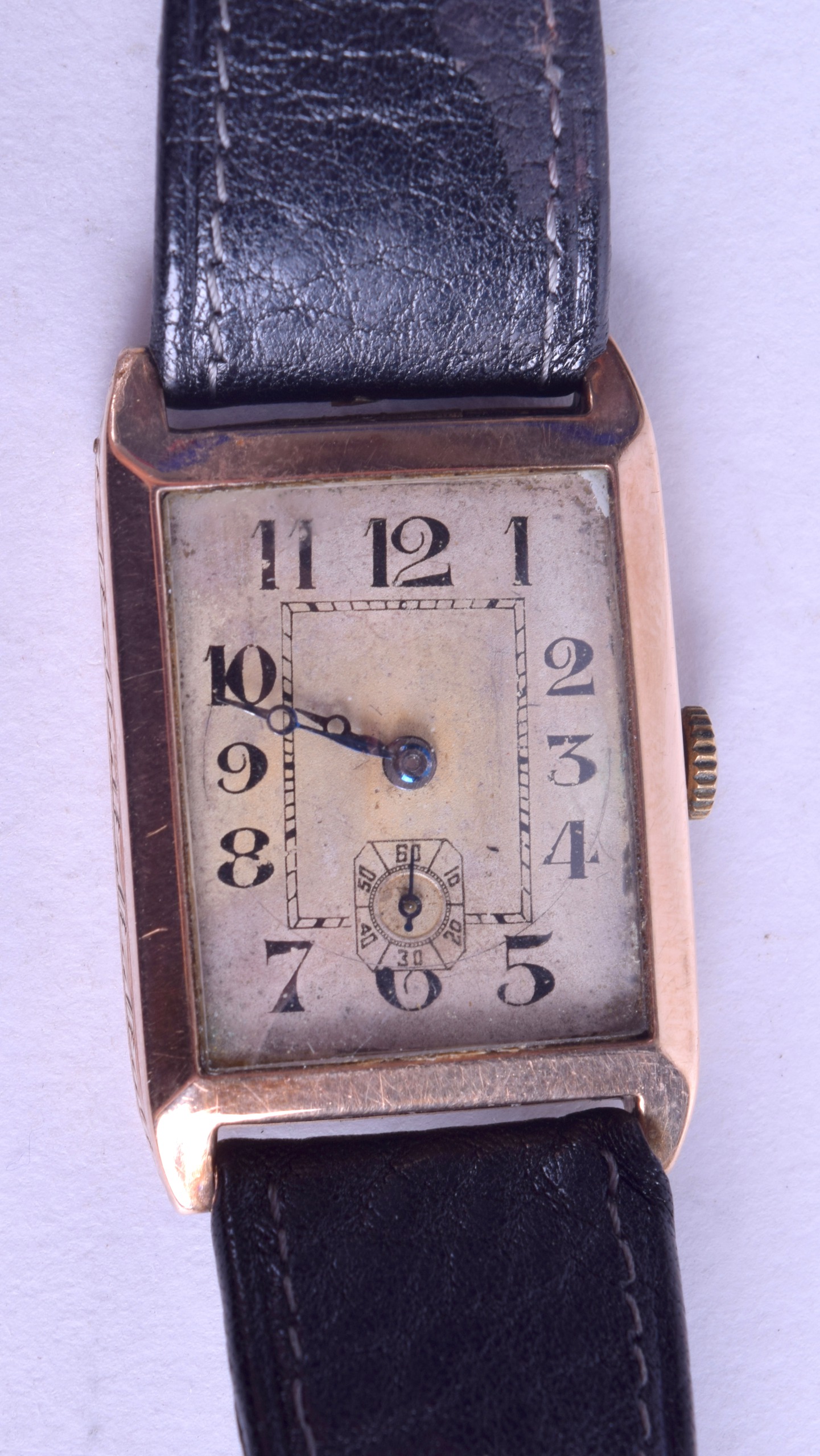 A VINTAGE 9CT GOLD GENTLEMANS WRISTWATCH with rectangular dial and black numerals. 19.5 grams