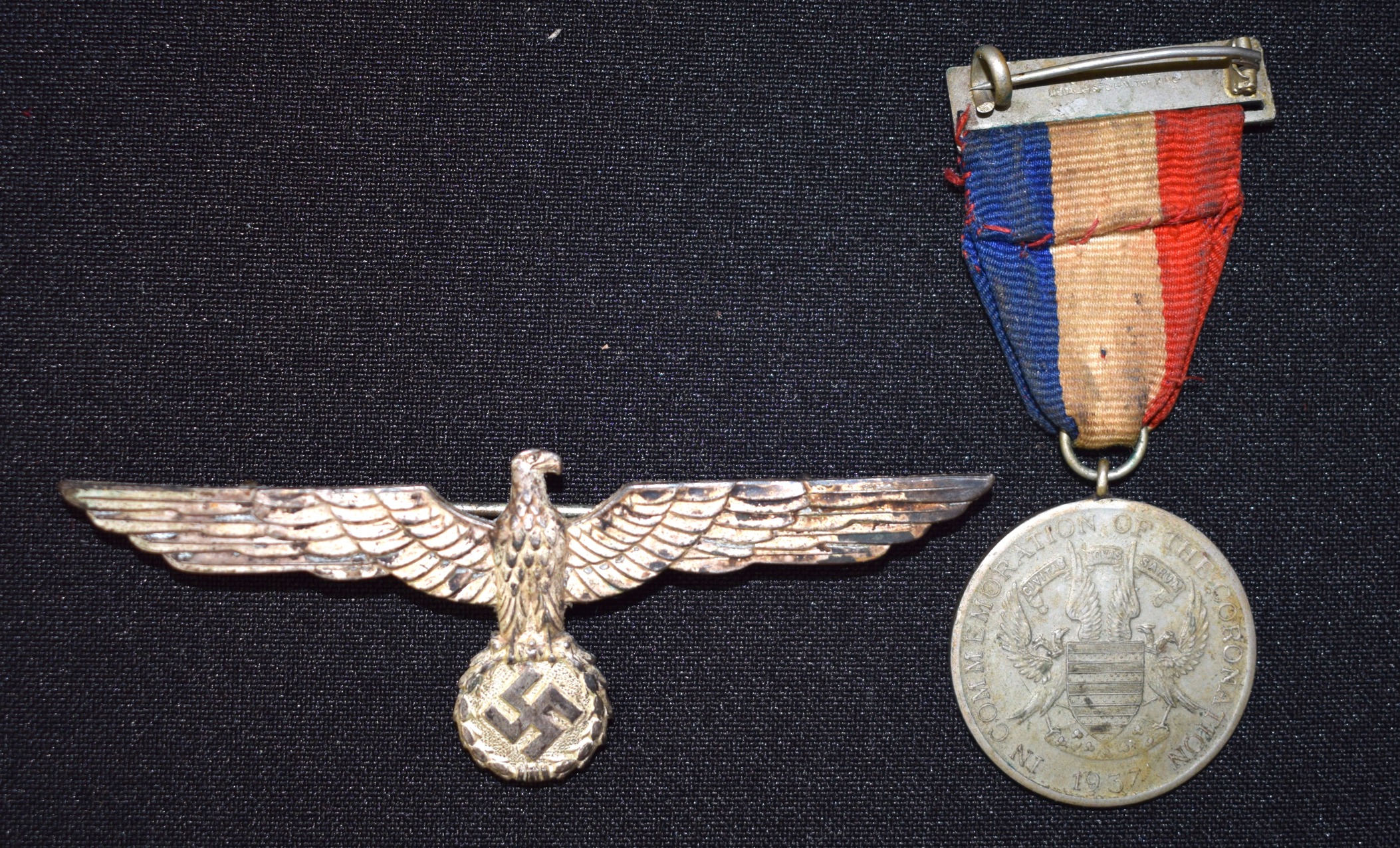 A NAZI MEDAL, together with another medal. (2)