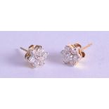 A PAIR OF 18CT GOLD AND DIAMOND EARRINGS. 11.6 grams.