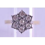 A 9CT GOLD AND DIAMOND DAISY CLUSTER RING. Size N.