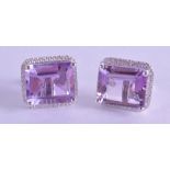 A PAIR OF SILVER SQUARE CUT AMETHYST EARRINGS.