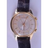 A GOOD 18CT GOLD GENTLEMANS JAEGER LECOULTRE WRISTWATCH with alarm feature and gold numerals. 3.5 cm