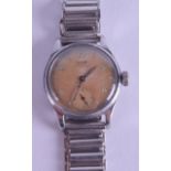 A VINTAGE TISSOT ANTI MAGNETIC STAINLESS STEEL WRISTWATCH with unusual peach toned enamelled dial.