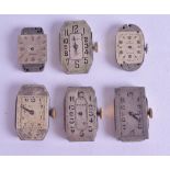 A GROUP TWELVE VINTAGE ROLEX WATCH FACES AND MOVEMENTS in various forms and sizes. (12)