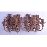 A PAIR OF ANTIQUE FRENCH CARVED WOODEN WALL BRACKET CANDLEABRA formed as mask heads encased within