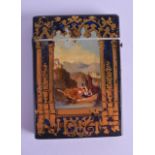 A VICTORIAN PAPIER MACHE CARD CASE painted with figures on boats within mountainous landscapes. 7.