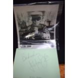 ELTON JOHN AUTOGRAPH, together with a picture.