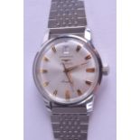 A LOVELY BOXED LONGINES AUTOMATIC CONQUEST WRISTWATCH with silvered dial and gilt numerals, the