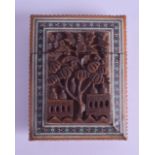 A 19TH CENTURY INDIAN CARVED SANDALWOOD MOSAIC CARD CASE decorated in relief with buildings and