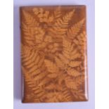 AN UNUSUAL VICTORIAN WOODEN CARD CASE imprinted with fern leaves. 7.75 cm x 11.5 cm.