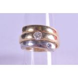 AN 18CT TWO TONE GOLD AND DIAMOND RING. 15 grams. Size O/P.