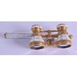 A PAIR OF ANTIQUE FRENCH BRASS AND MOTHER OF PEARL OPERA GLASSES. 17 cm wide.