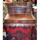 A GOOD EARLY 20TH CENTURY CHINESE CARVED HARDWOOD DESK, with carved frieze on cabriole legs. 119