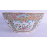 A LARGE MID 19TH CENTURY CHINESE CANTON FAMILLE ROSE BOWL painted with birds, flowers and blue