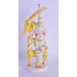 A RARE WALTER BOSSE AUGARTEN FIGURE OF A BOY AND ANTELOPE C1920, painted in bright yellow and