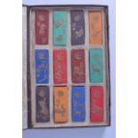 A CASED SET OF TWELVE CHINESE INK BLOCKS decorated with animals from the zodiac. Each 3 cm x 7.5