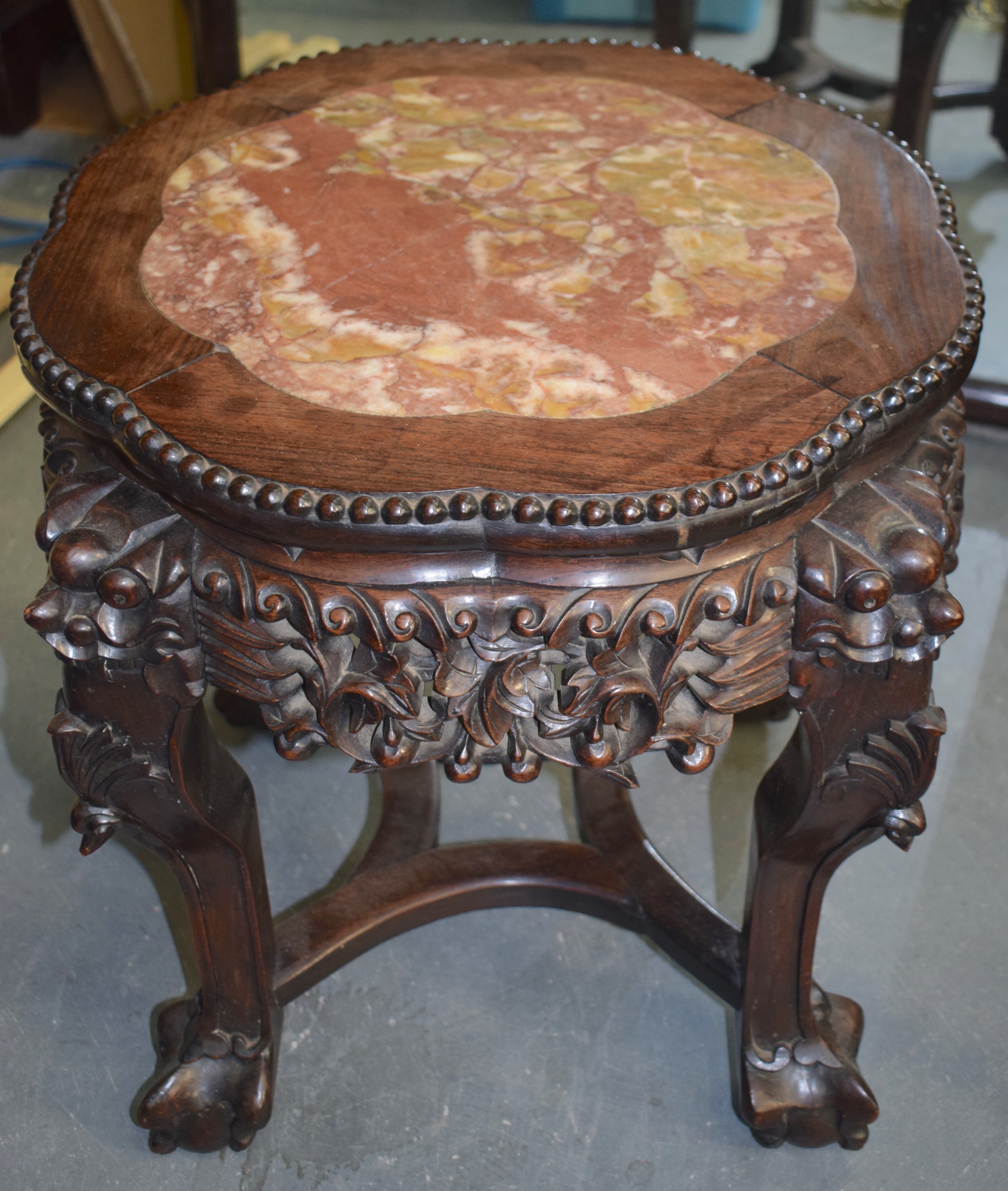 A 19TH CENTURY MARBLE INSET LOBED CHINESE STAND, with carved foliate frieze. 46 cm x 54 cm.