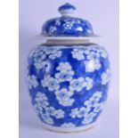 A 17TH/18TH CENTURY CHINESE BLUE AND WHITE GINGER JAR AND COVER Kangxi, painted with flowers. 29