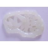 AN UNUSUAL CHINESE CARVED WHITE JADE OPENWORK PLAQUE of naturalistic form. 8 cm x 5 cm.