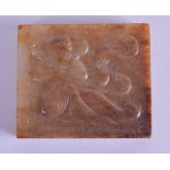 A CHINESE QING DYNASTY CARVED MUTTON JADE RECTANGULAR TABLET decorated with a figure wearing flowing