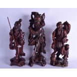 A GROUP OF THREE LATE 19TH CENTURY CHINESE CARVED HARDWOOD FIGURES modelled upon open work bases.