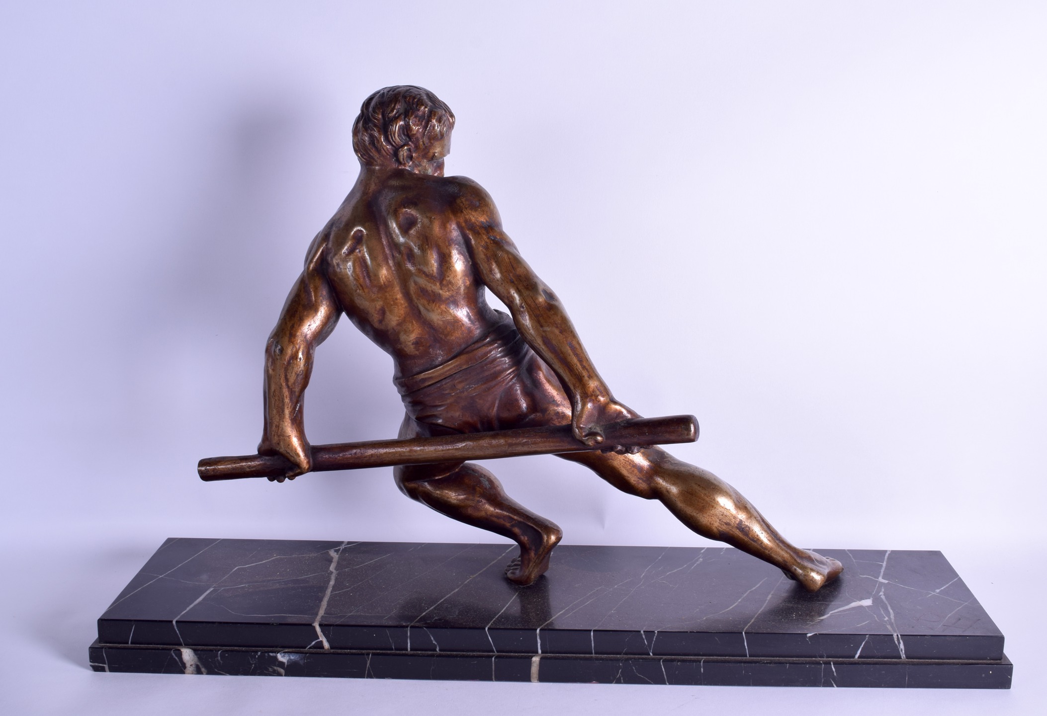 A LARGE ART DECO POLISHED BRONZE FIGURE OF A MUSCULAR MALE modelled upon a veined marble base. 66 cm - Image 2 of 2