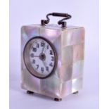 A SMALL 1920S MOTHER OF PEARL CARRIAGE CLOCK with white enamel dial. 8.5 cm high inc handle.