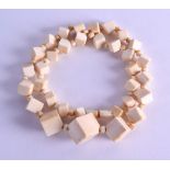 AN UNUSUAL EARLY 20TH CENTURY EUROPEAN CARVED IVORY NECKLACE formed with square ivory blocks. 60